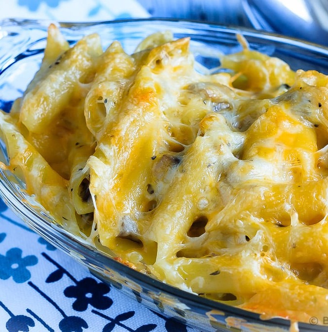 Baked Shrimp Pasta with Mushroom Alfredo Sauce - Creamy baked pasta with a clam and mushroom alfredo sauce - cheesy comfort food at it's best! You will make this pasta again and again!