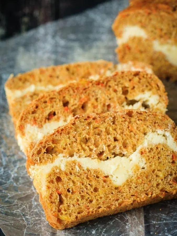 Cream Cheese Filled Carrot Bread - A healthier carrot bread filled with a cream cheese ribbon - healthy enough for breakfast but enough like carrot cake to feel like a treat!