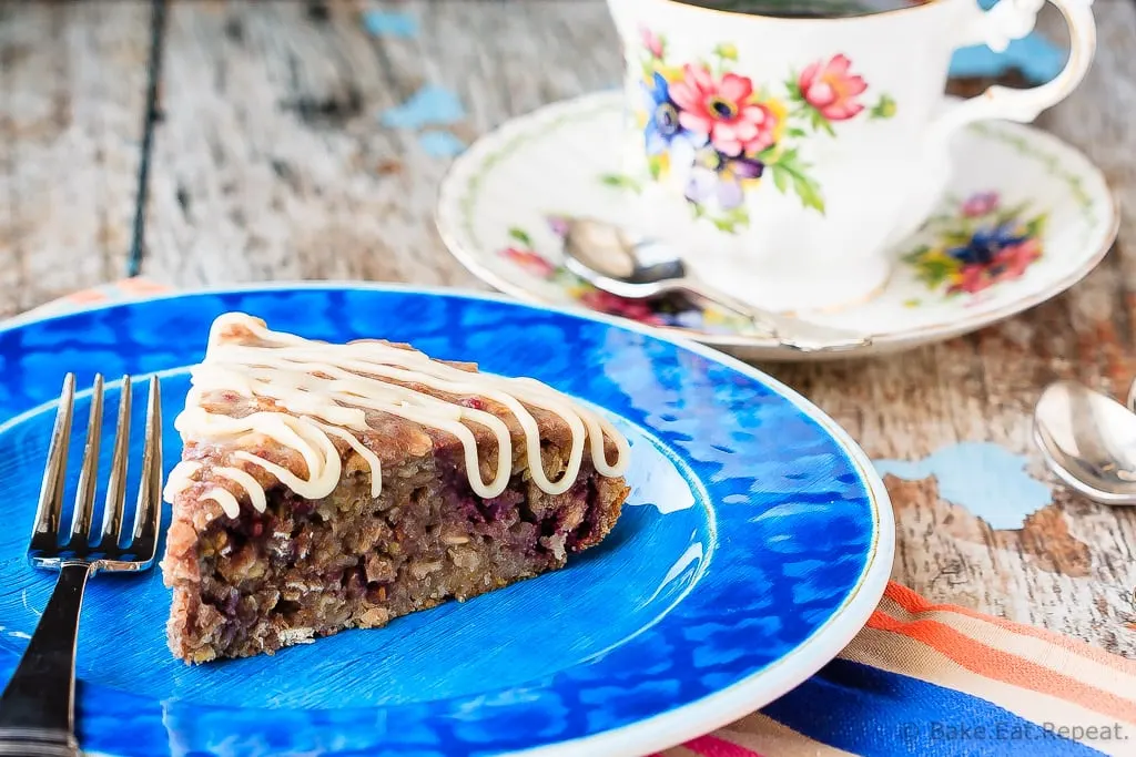 Banana Berry Oatmeal Cake - This banana berry oatmeal cake with a vanilla glaze is quick and easy to whip up, and makes a fantastic breakfast or a healthy snack!