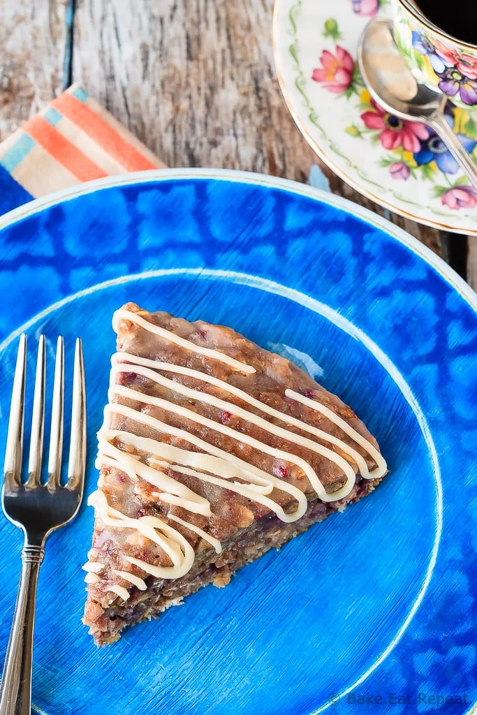 Banana Berry Oatmeal Cake - This banana berry oatmeal cake with a vanilla glaze is quick and easy to whip up, and makes a fantastic breakfast or a healthy snack!