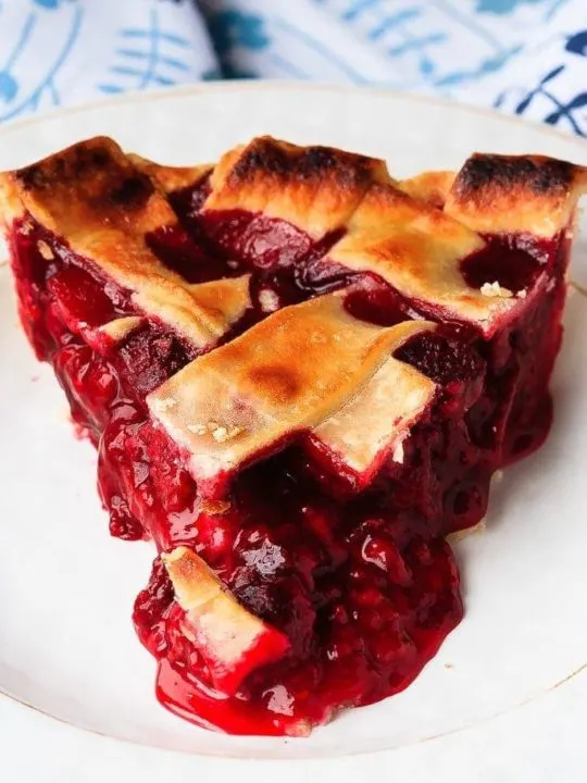 Raspberry Pie - Easy to make raspberry pie can be made with either fresh or frozen raspberries. This is the perfect dessert - tart, sweet, perfect raspberry pie!