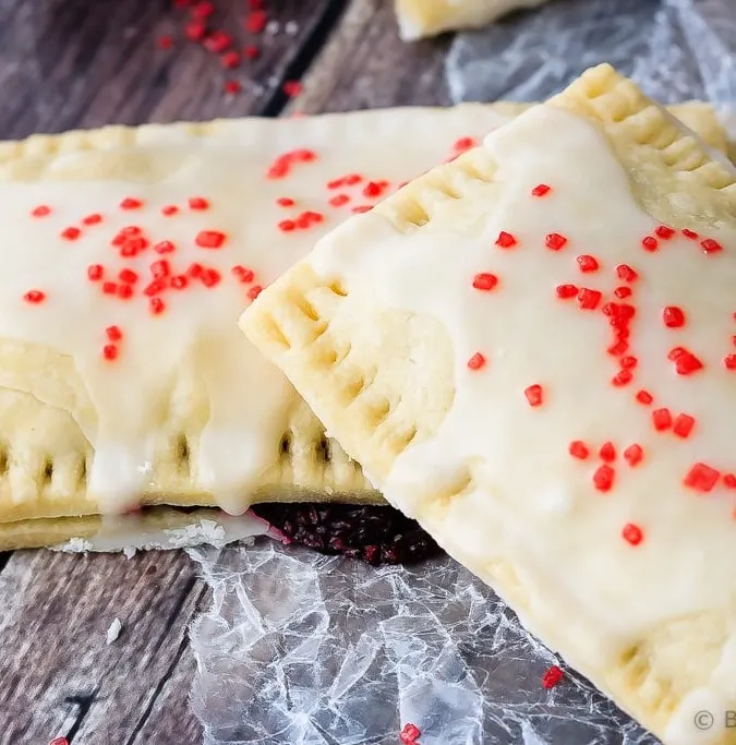 Berry Pop Tarts - Easy to make homemade berry pop tarts that are better then the real thing. Flaky pastry, homemade berry filling and a sweet frosting - pie for breakfast?