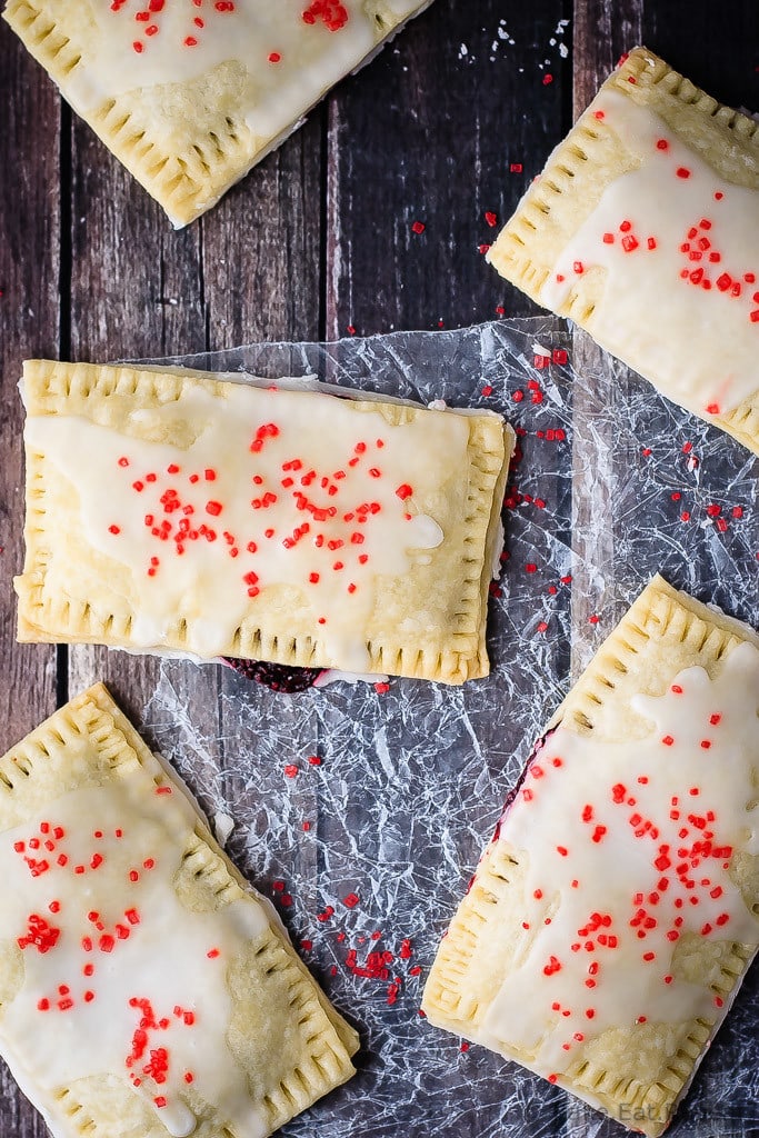 Berry Pop Tarts - Easy to make homemade berry pop tarts that are better then the real thing. Flaky pastry, homemade berry filling and a sweet frosting - pie for breakfast?