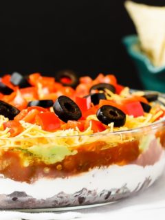 Mexican 7 Layer Dip - Quick and easy Mexican 7 layer dip - takes minutes to make and is an absolutely fantastic appetizer or snack. Everyone will love this!