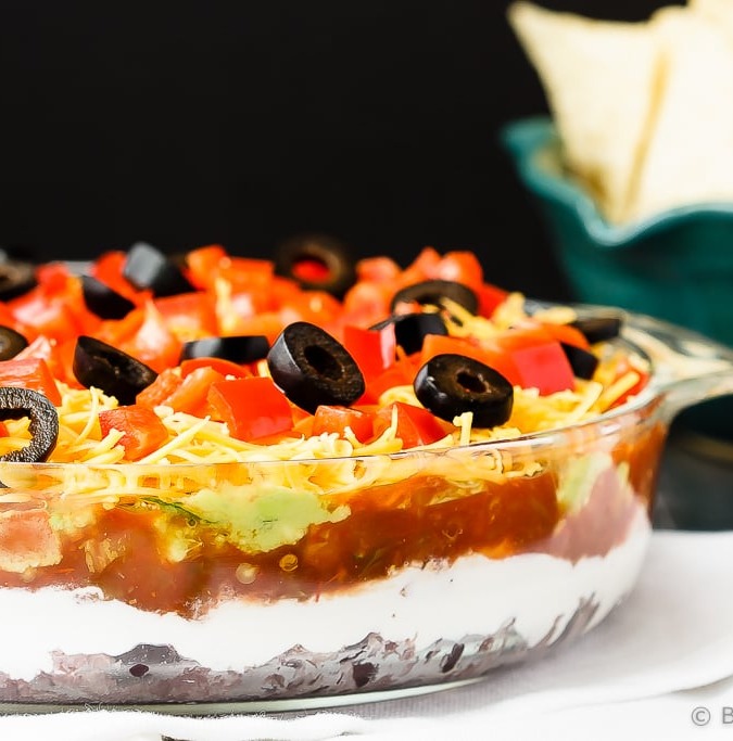 Mexican 7 Layer Dip - Quick and easy Mexican 7 layer dip - takes minutes to make and is an absolutely fantastic appetizer or snack. Everyone will love this!