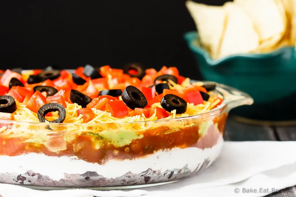 Mexican 7 Layer Dip - Quick and easy Mexican 7 layer dip - takes minutes to make and is an absolutely fantastic appetizer or snack. Everyone will love this!