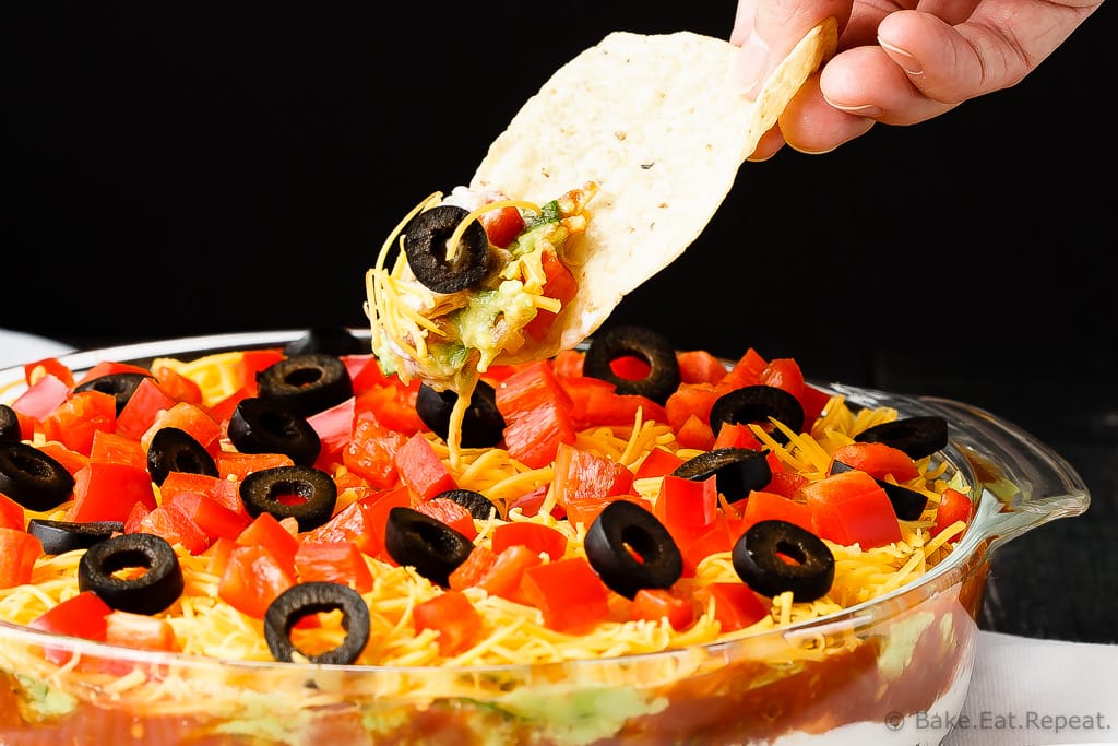 Mexican 7 Layer Dip - Quick and easy Mexican 7 layer dip - takes minutes to make and is an absolutely fantastic appetizer or snack. Everyone will love this!