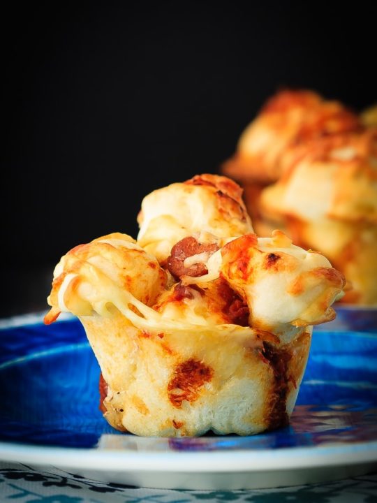 Pull Apart Pizza Muffins - Easy to make, pull apart pizza muffins that are perfect for supper or a snack, or as an easy on-the-go meal. The whole family will love these pizza muffins!