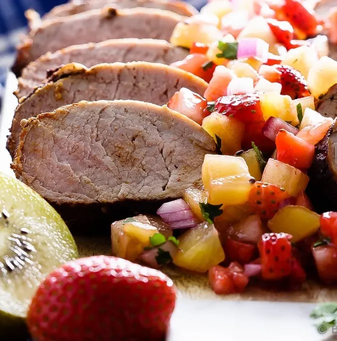 Grilled Pork Tenderloin with Strawberry Kiwi Salsa - Cinnamon chili grilled pork tenderloin with a strawberry kiwi salsa - fast and easy to make and absolutely perfect for your summer BBQ!