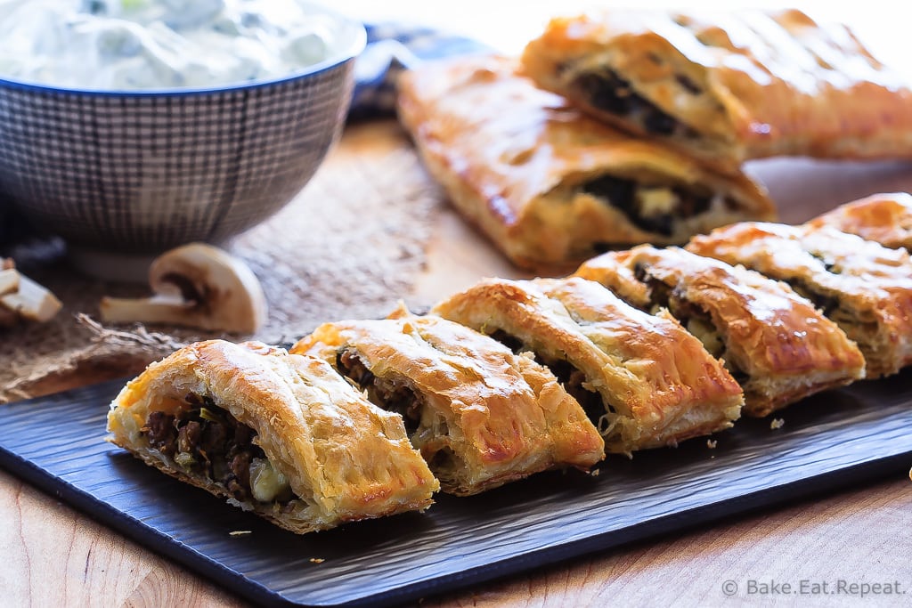 Beef Spinach and Mushroom Strudel - An easy appetizer made with puff pastry that everyone will love - this savoury strudel is filled with ground beef, mushrooms, spinach and feta cheese and served with tzatziki dip. 