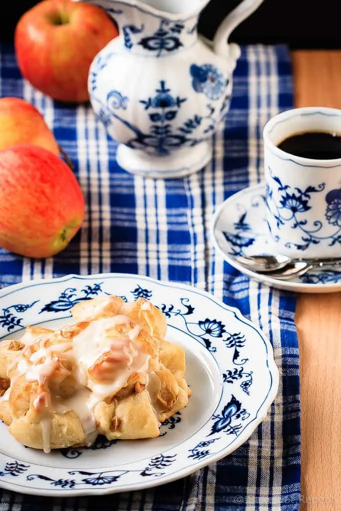 Baked Apple Fritters - These baked apple fritters are easy to make and taste amazing - soft, tender, cinnamon spiced dough studded with apples and drizzled with a vanilla glaze.