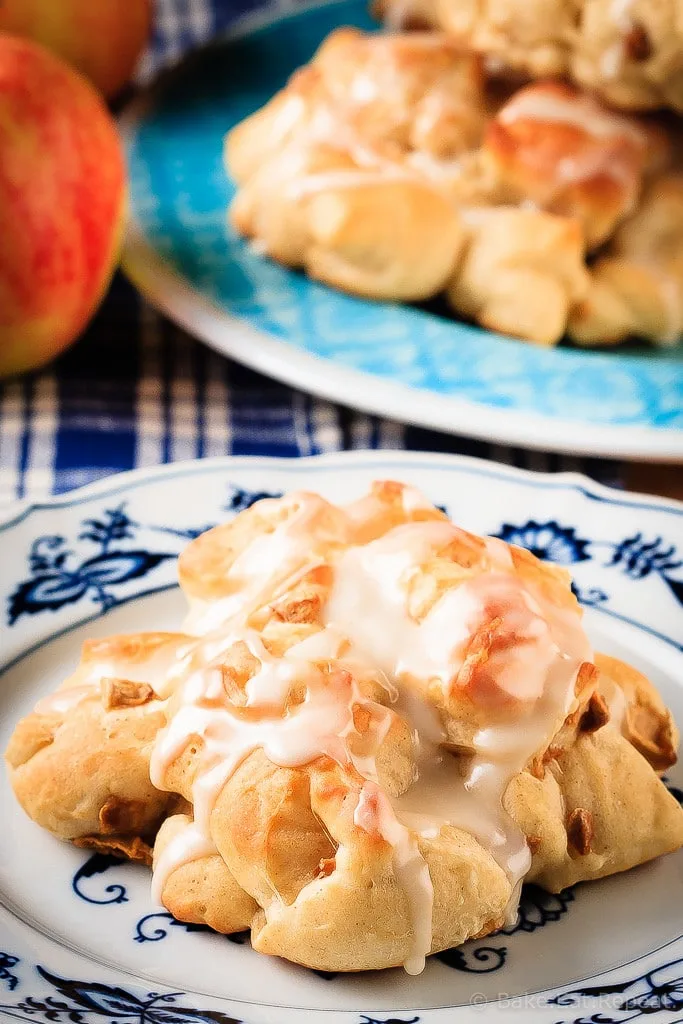 Baked Apple Fritters - These baked apple fritters are easy to make and taste amazing - soft, tender, cinnamon spiced dough studded with apples and drizzled with a vanilla glaze.