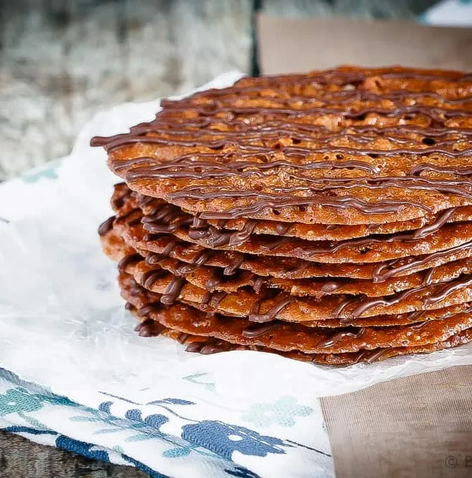 Lacey Cookies - These lacey cookies are surprisingly easy to make - made with ground pecans and drizzled with chocolate, you will have a hard time eating just one!