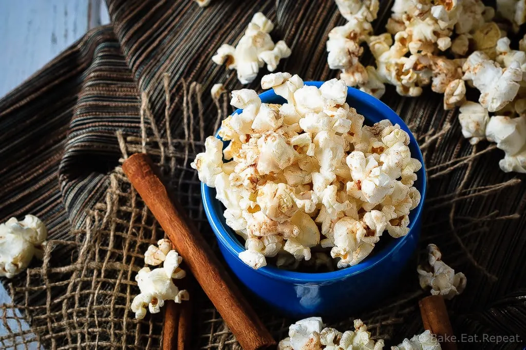 Cinnamon Roll Popcorn - A great way to change up the usual movie night snack, this cinnamon roll popcorn is a wonderful sweet and salty snack that everyone will love!