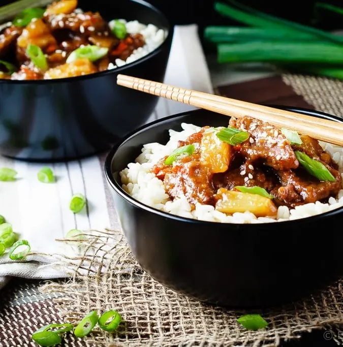 Spicy Mongolian Beef and Pineapple - Spicy Mongolian beef and pineapple made in the slow cooker - a super easy meal to make at home that is even better then takeout!