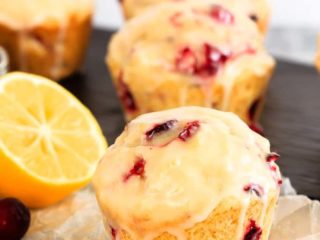 Glazed Lemon Cranberry Muffins - These glazed lemon cranberry muffins are light and fluffy with the tart, fresh cranberries complimenting the sweet lemon glaze perfectly!