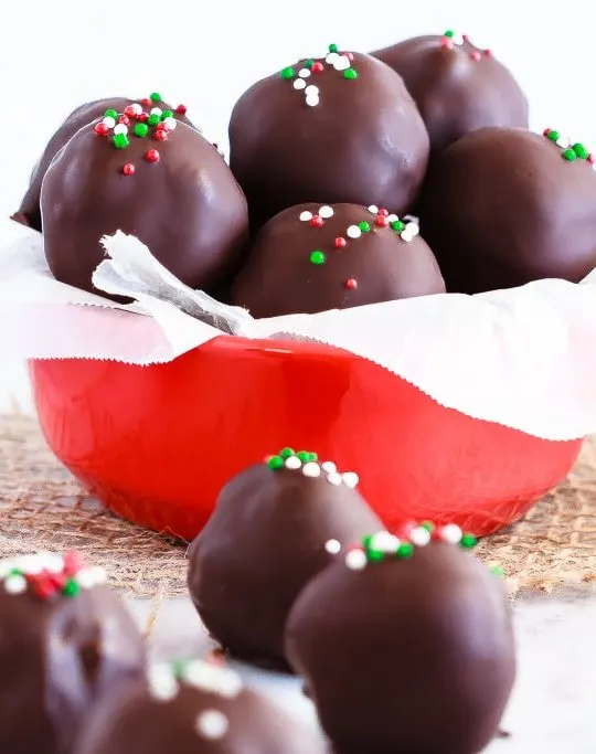 Peppermint Brownie Truffles - Rich, delicious, peppermint brownie truffles - a homemade peppermint patty filling surrounding by rich brownie crumbles and coated in chocolate!