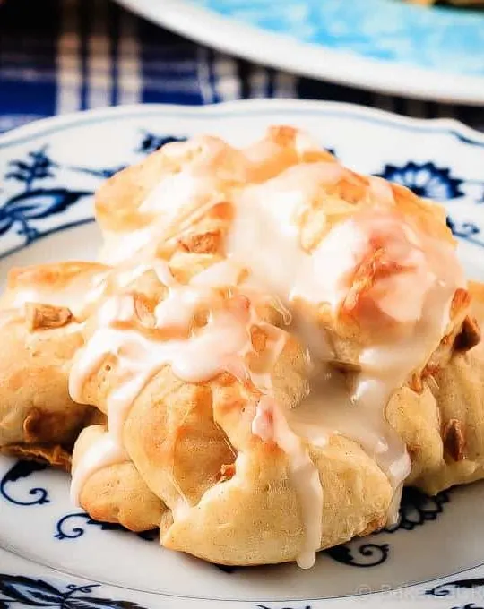 These baked apple fritters are easy to make and taste amazing - soft, tender, cinnamon spiced dough studded with apples and drizzled with a vanilla glaze.