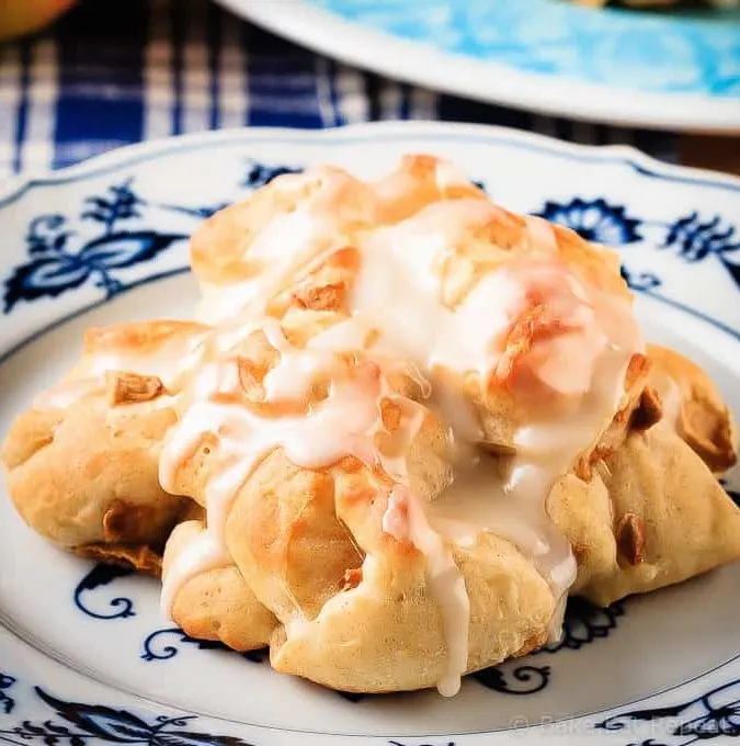 These baked apple fritters are easy to make and taste amazing - soft, tender, cinnamon spiced dough studded with apples and drizzled with a vanilla glaze.