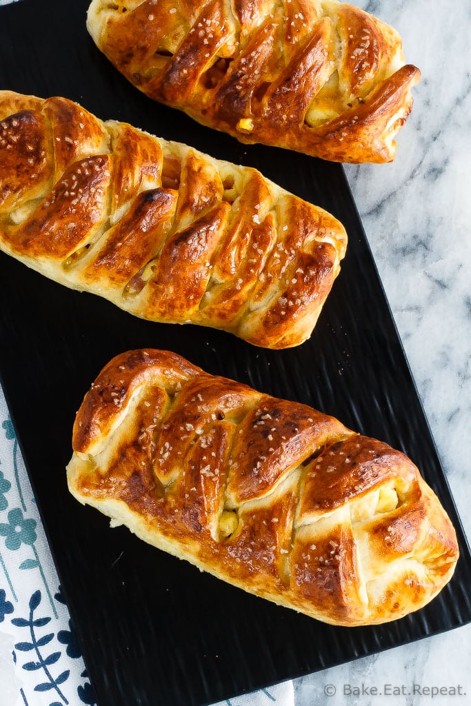 These braided ham, egg and cheese pretzel rolls are the perfect hand held meal. Plus they're easy to take along with you for breakfast or lunch on the go!