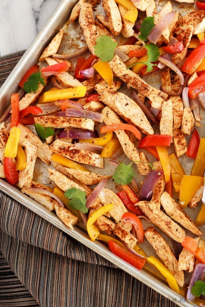 Quick and easy chicken fajitas with just one sheet pan to clean afterwards! This is my new favourite way to make one of my family's favourite meals!