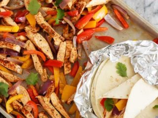 Quick and easy chicken fajitas with just one sheet pan to clean afterwards! This is my new favourite way to make one of my family's favourite meals!