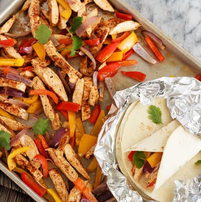 Quick and easy chicken fajitas with just one sheet pan to clean afterwards! This is my new favourite way to make one of my family's favourite meals!