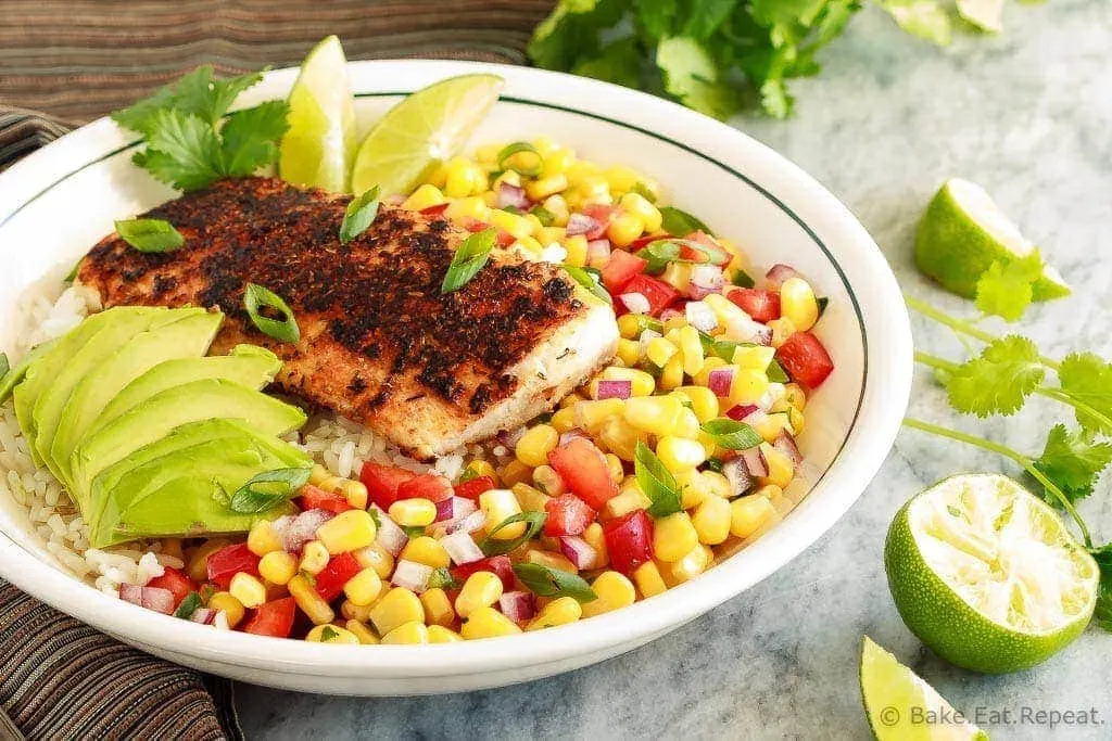 These blackened fish taco bowls with corn salsa are quickly becoming a family favourite! Spicy fish, fresh avocado, and corn salsa served on hot rice. So good!