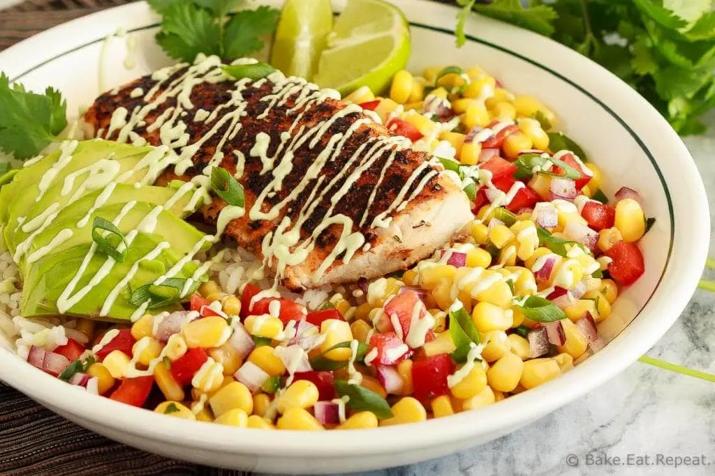 These blackened fish taco bowls with corn salsa are quickly becoming a family favourite! Spicy fish, fresh avocado, and corn salsa served on hot rice. So good!