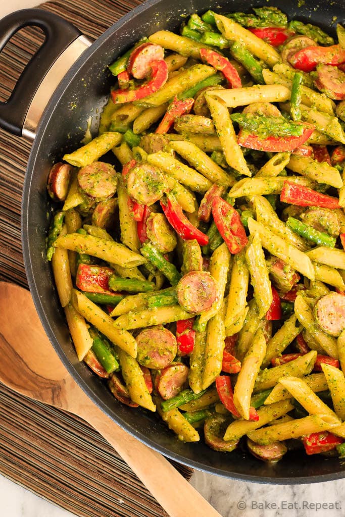 This quick and easy one pot pesto pasta with chicken sausage, asparagus and red peppers is an easy weeknight meal that the whole family will love!