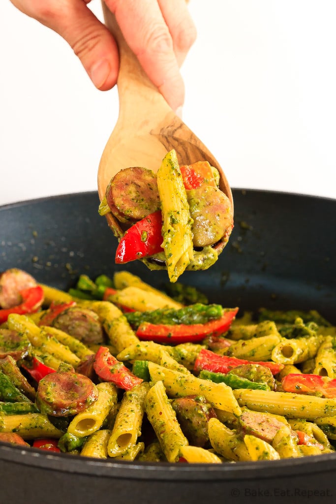 This quick and easy one pot pesto pasta with chicken sausage, asparagus and red peppers is an easy weeknight meal that the whole family will love!