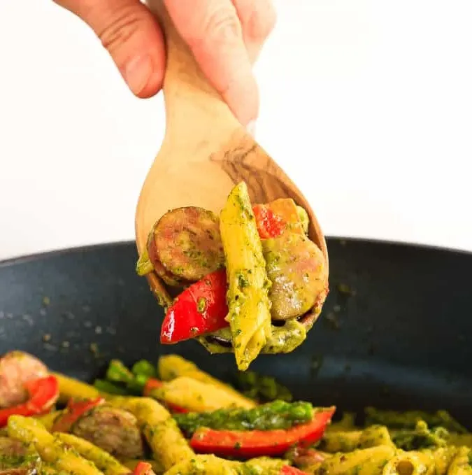 This quick and easy one pot pesto pasta with chicken sausage, asparagus and red peppers is an easy weeknight meal that the whole family will love!