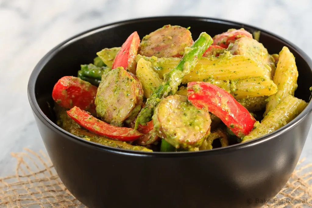 This quick and easy one pot pesto pasta with chicken sausage, asparagus and red peppers is an easy weeknight meal that the whole family will love!