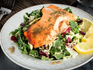 This honey lemon baked salmon with a sunflower kale salad is quick and easy to make and you will love it! A 30 minute meal you'll make again and again!