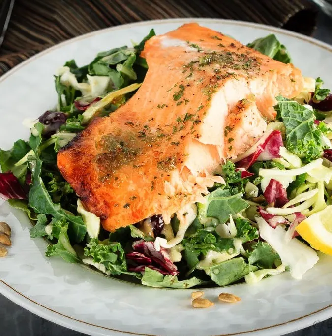 This honey lemon baked salmon with a sunflower kale salad is quick and easy to make and you will love it! A 30 minute meal you'll make again and again!