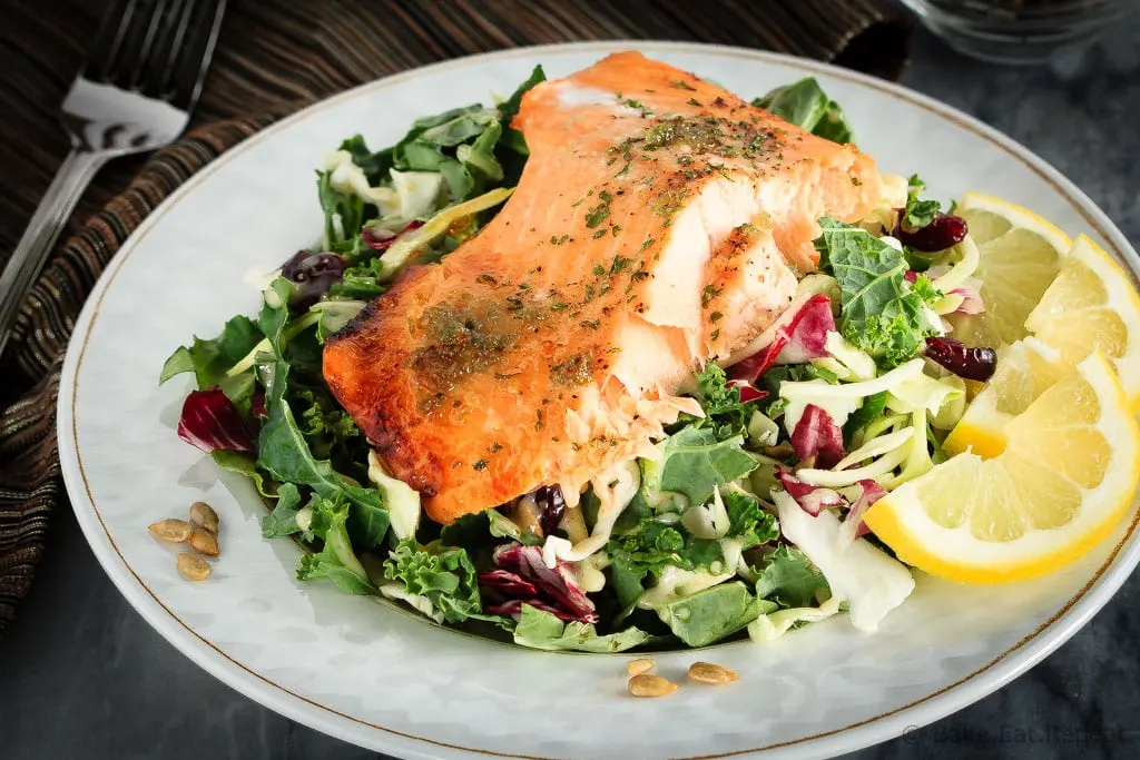 This honey lemon baked salmon with a sunflower kale salad is quick and easy to make and you will love it! A 30 minute meal you'll make again and again!