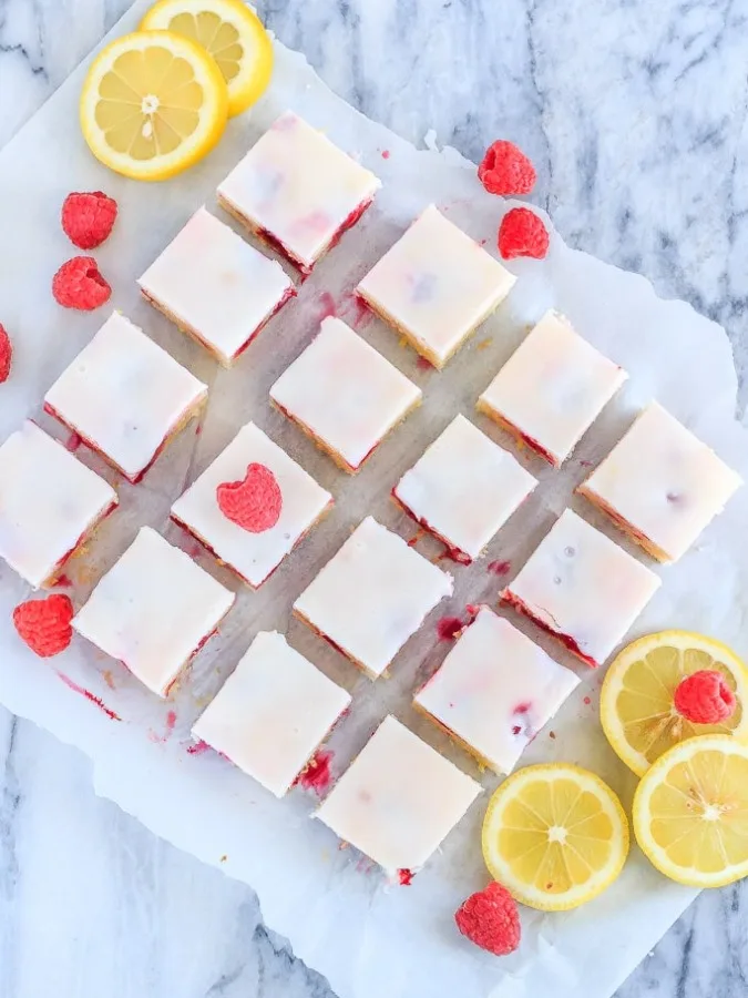 Fast and easy to make, these chewy raspberry lemon blondies are just the right mix of tart and sweet - and will disappear way too quickly!