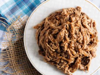 This tender maple balsamic pork tenderloin takes just minutes to get into the slow cooker and is amazing piled onto a soft roll for an easy dinner!
