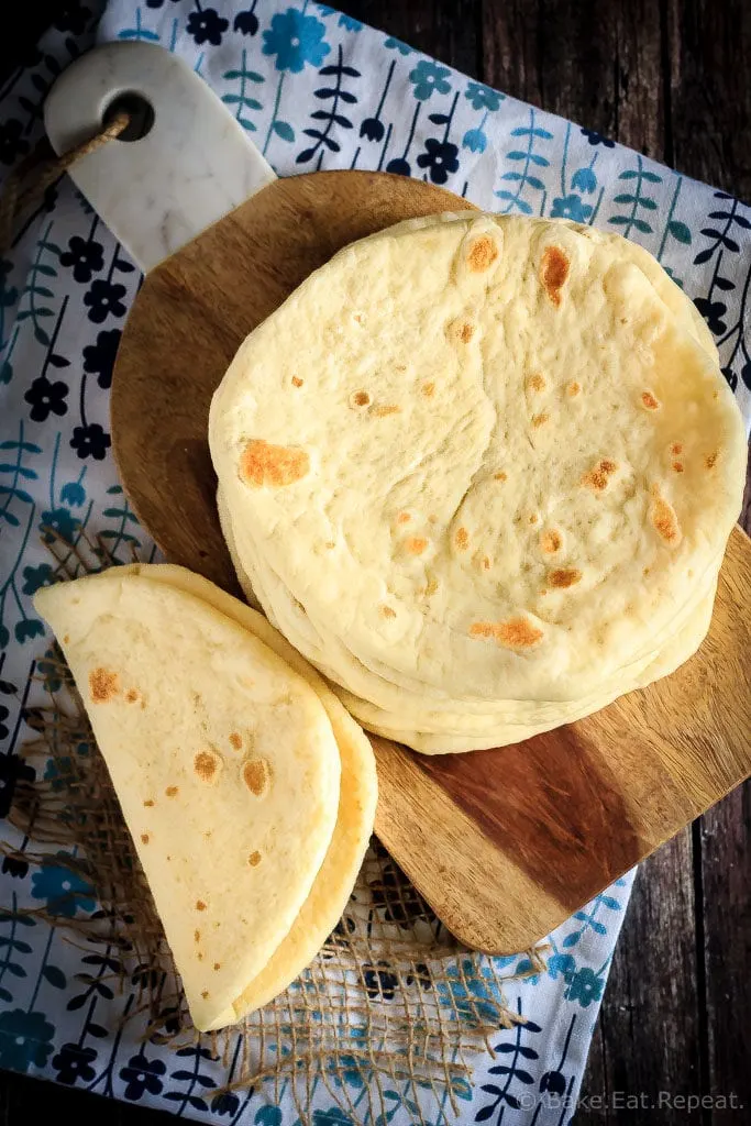 This homemade soft flatbread recipe is super easy to make and is perfect for sandwiches, gyros or even mini pizzas!