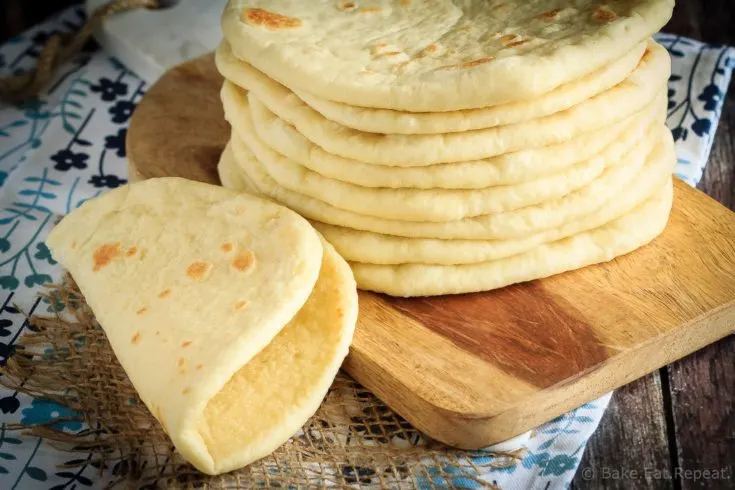 This homemade soft flatbread recipe is super easy to make and is perfect for sandwiches, gyros or even mini pizzas!