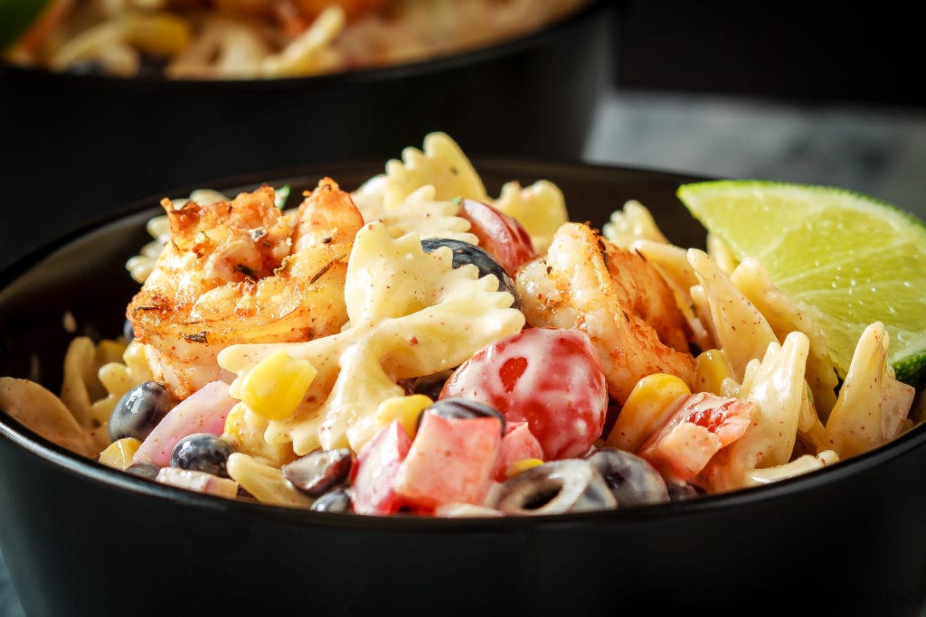 This Mexican pasta salad with cajun shrimp is perfect for summer - easy to make, the whole family will love it, and it can even be made ahead of time!