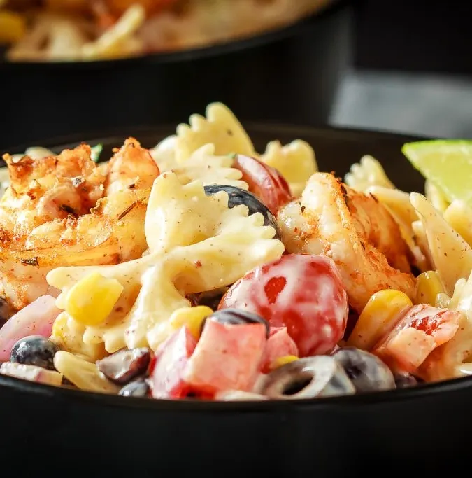 This Mexican pasta salad with cajun shrimp is perfect for summer - easy to make, the whole family will love it, and it can even be made ahead of time!