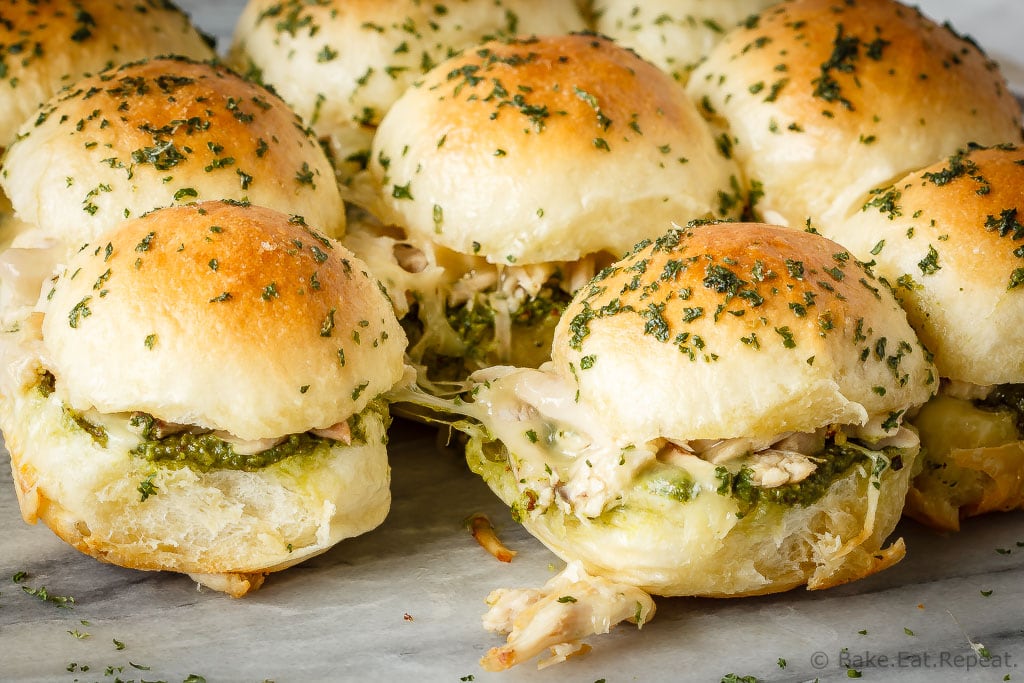 These easy to make, pesto chicken pull apart sliders are the perfect quick and easy dinner - and the leftover sliders are amazing for lunch the next day!