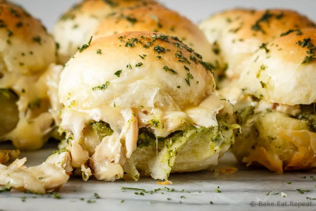 These easy to make, pesto chicken pull apart sliders are the perfect quick and easy dinner - and the leftover sliders are amazing for lunch the next day!