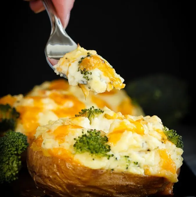 These twice baked potatoes filled with cheddar cheese and broccoli are the perfect side dish - they're easy to make and the whole family will love them!