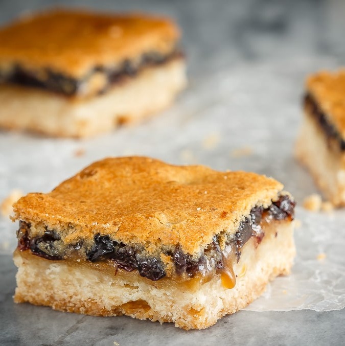 These butter tart squares are butter tarts in bar form - a shortbread base with a sweet topping made with butter, sugar and currants. Perfect for your holiday baking!