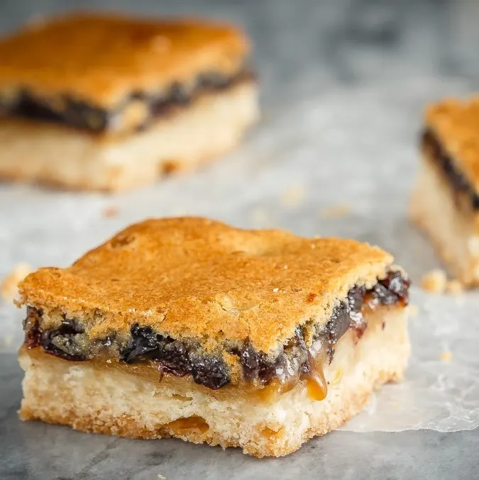 These butter tart squares are butter tarts in bar form - a shortbread base with a sweet topping made with butter, sugar and currants. Perfect for your holiday baking!