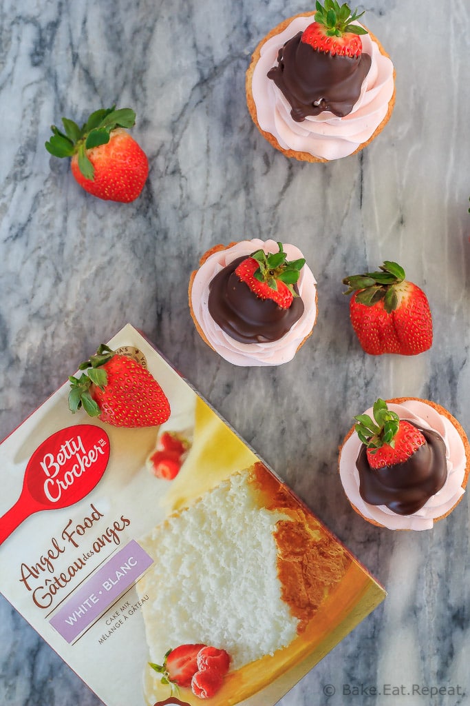 These chocolate covered strawberry cupcakes are the perfect sweet treat for Valentine's Day - angel food cupcakes with strawberry whipped cream frosting!