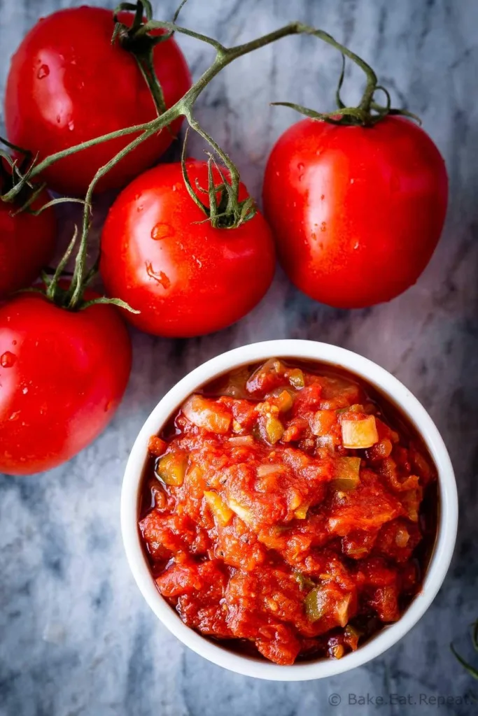 This homemade salsa is so much better then anything you can buy at the store, and is easy to make. You can even can it at home with a water bath canner so you can enjoy fresh tasting, homemade salsa all year long! (It also freezes well if canning isn't your thing!)