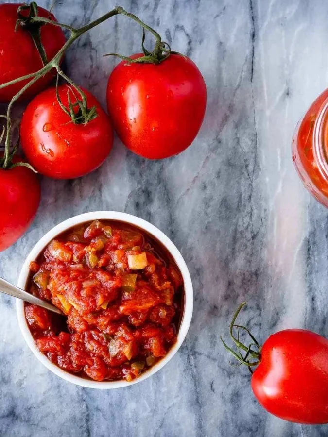 This homemade salsa is so much better then anything you can buy at the store, and is easy to make. You can even can it at home with a water bath canner so you can enjoy fresh tasting, homemade salsa all year long! (It also freezes well if canning isn't your thing!)